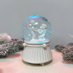 Декоративна музична снігова куля «Ангели» 18 см з LED-підсвіткою, ефектом снігопаду, 8 мелодіями та роботою від батарейок Декоративна музична снігова куля «Ангели» 18 см з LED-підсвіткою, ефектом снігопаду, 8 мелодіями та роботою від батарейок